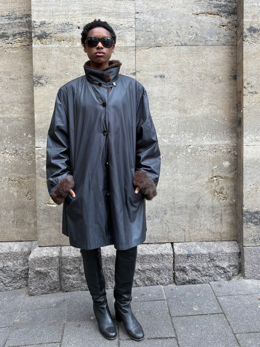 RAINCOAT WITH FUR DETAILING