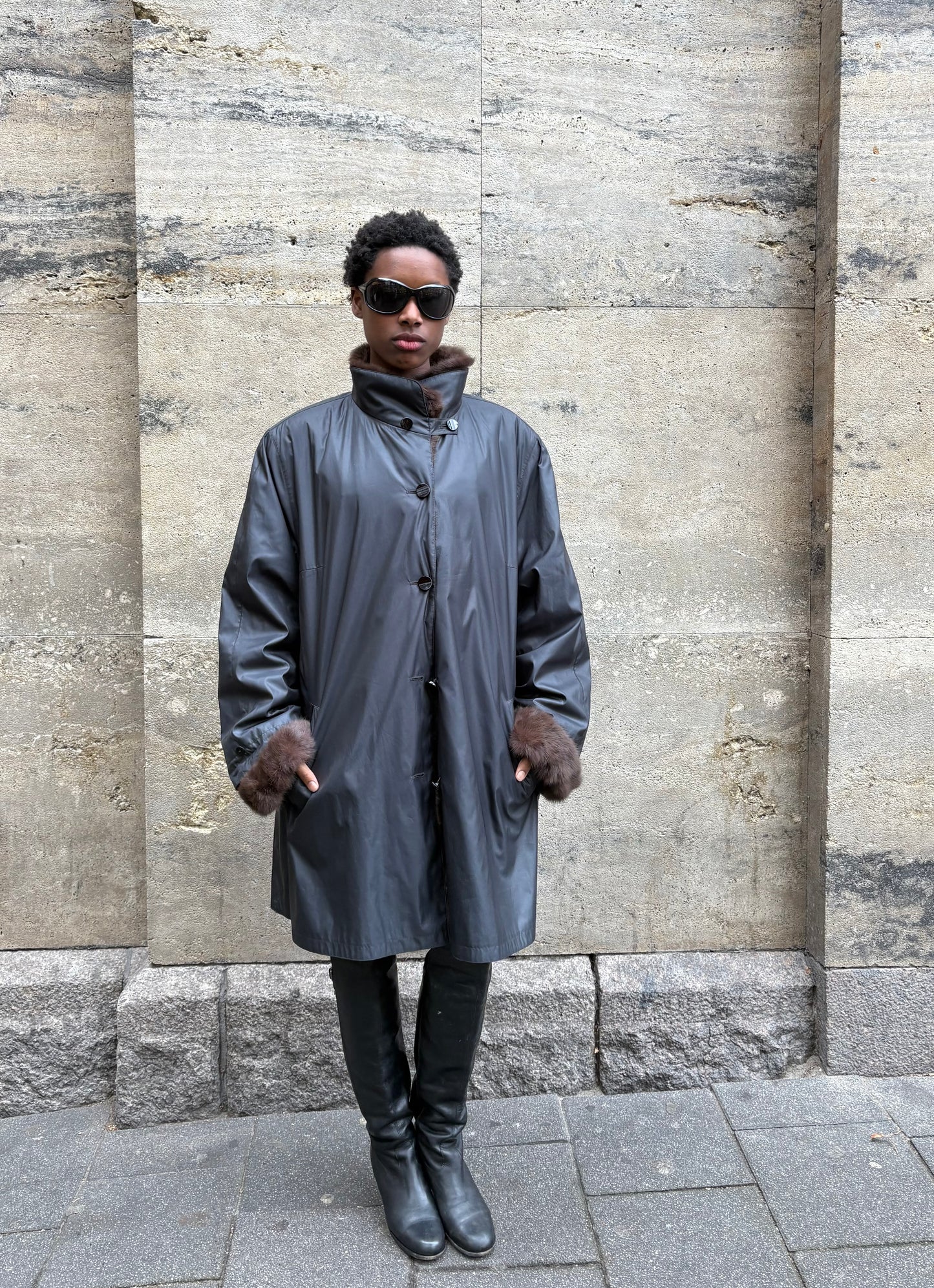 RAINCOAT WITH FUR DETAILING