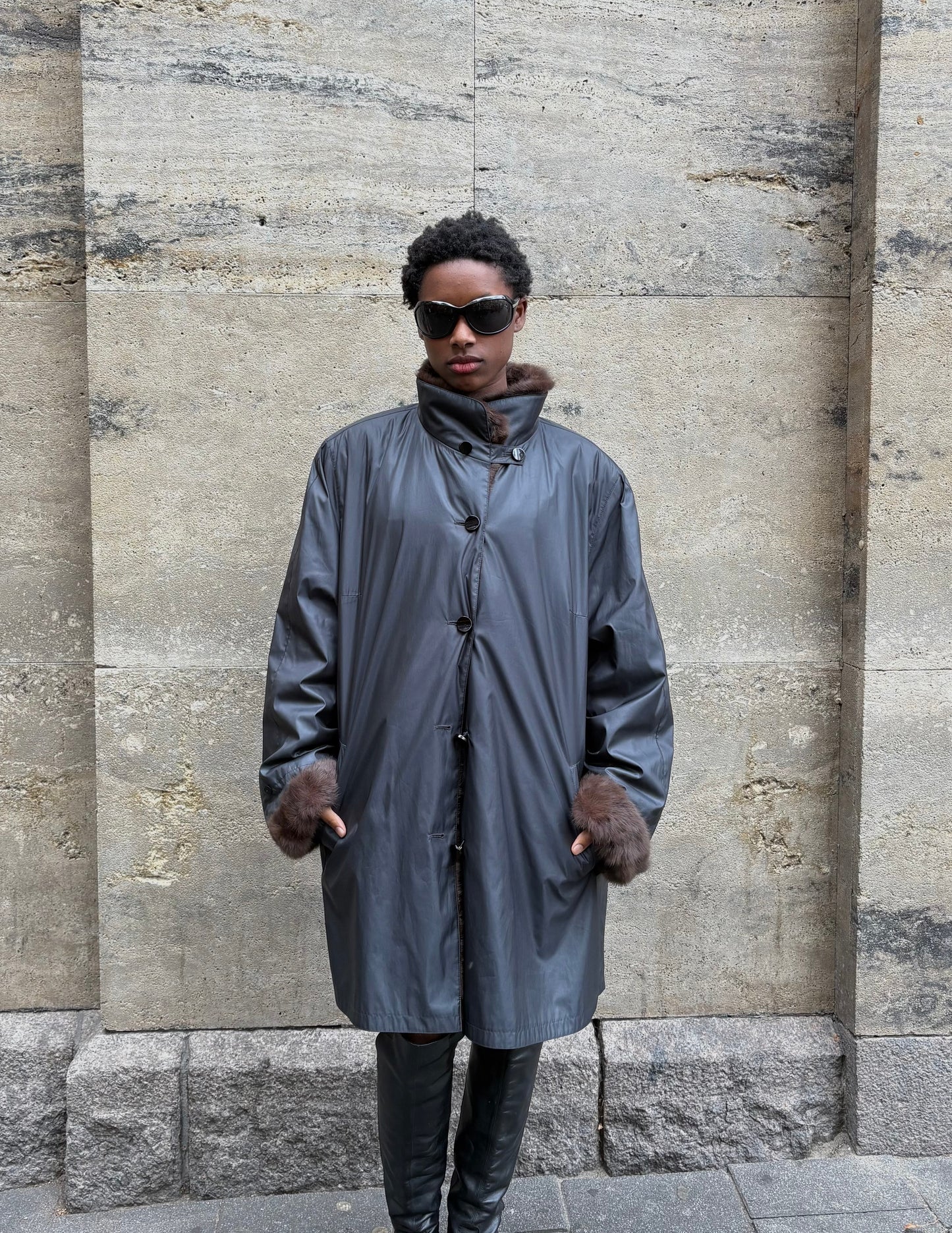 RAINCOAT WITH FUR DETAILING