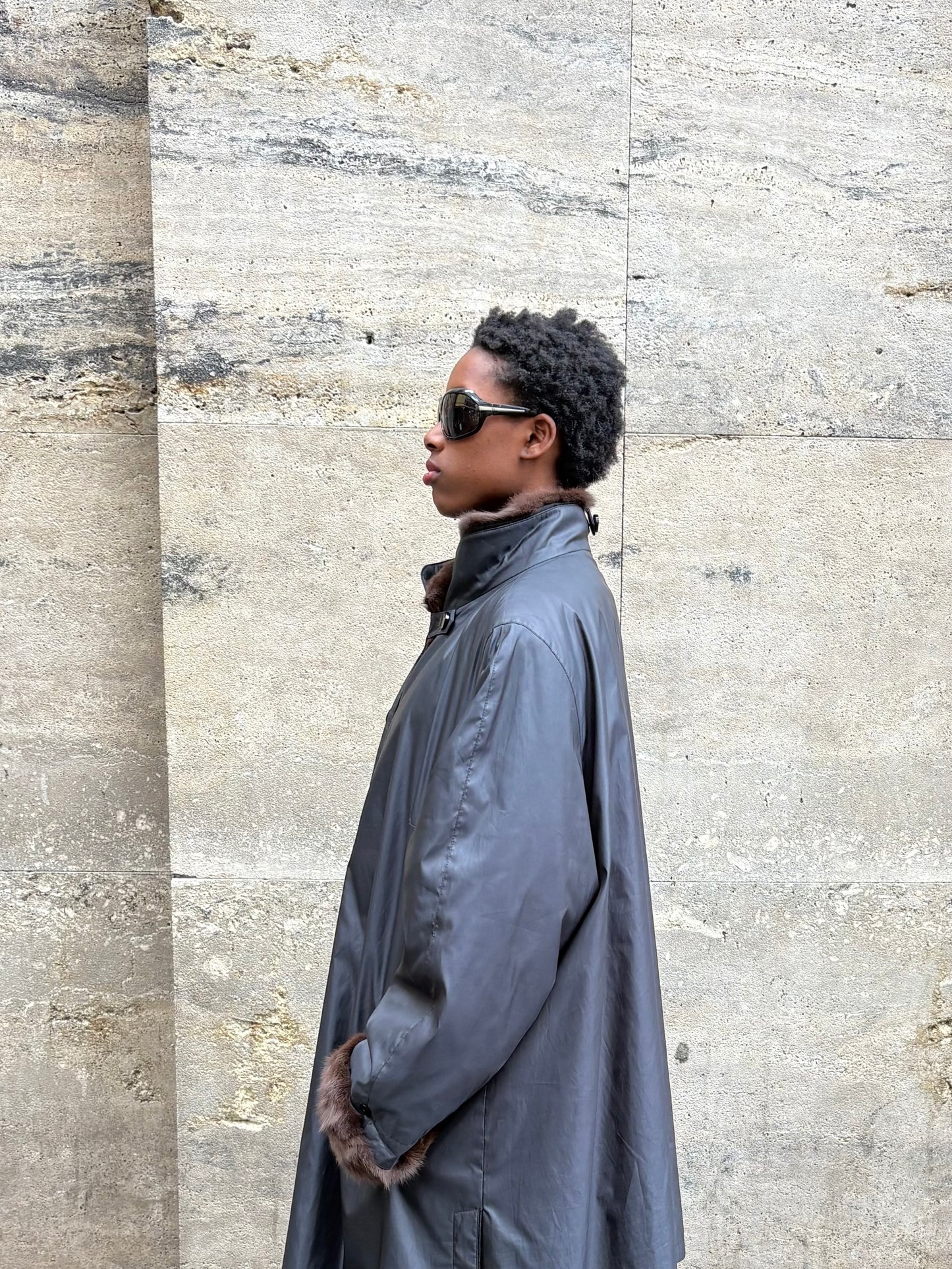 RAINCOAT WITH FUR DETAILING