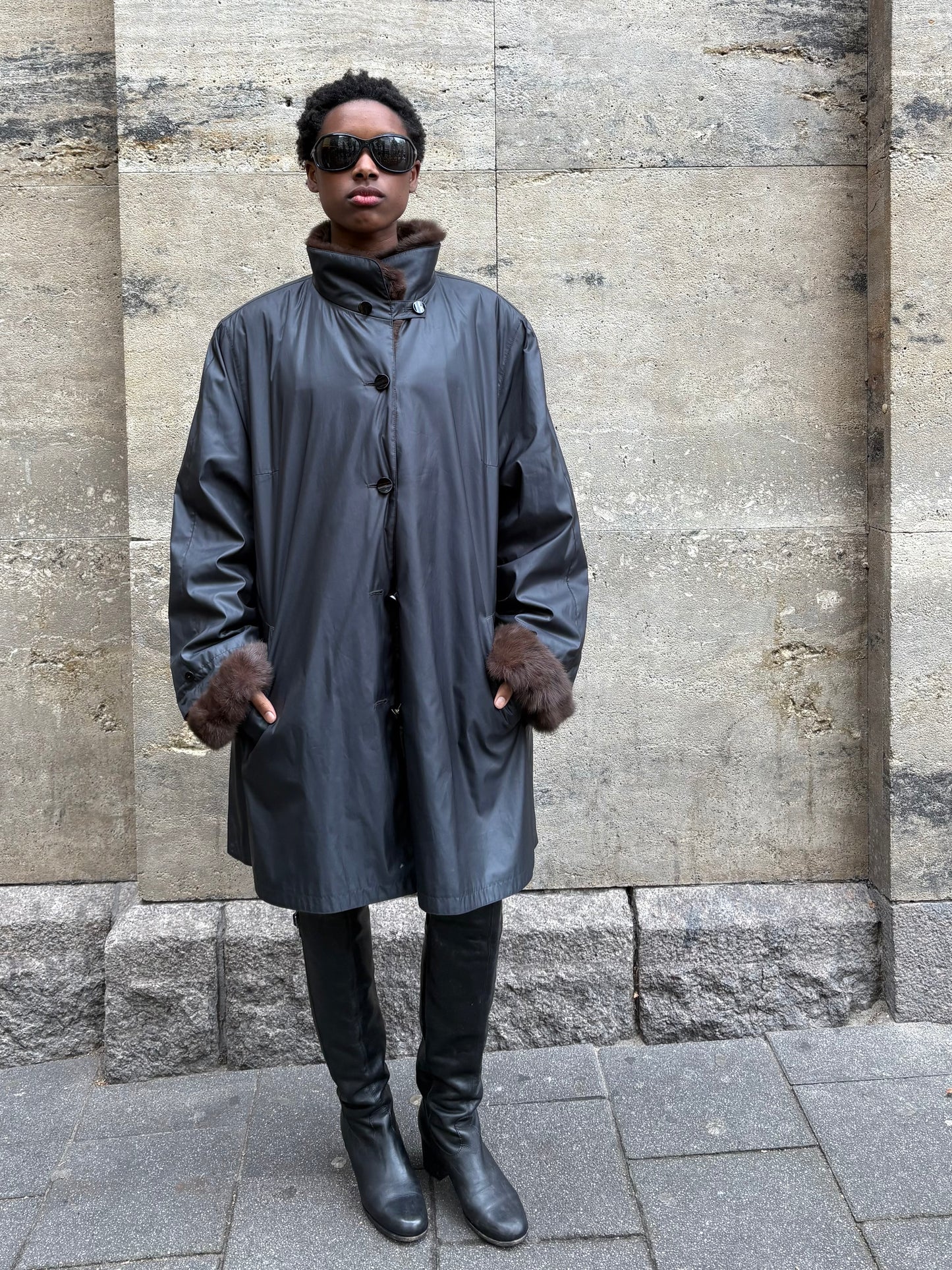 RAINCOAT WITH FUR DETAILING