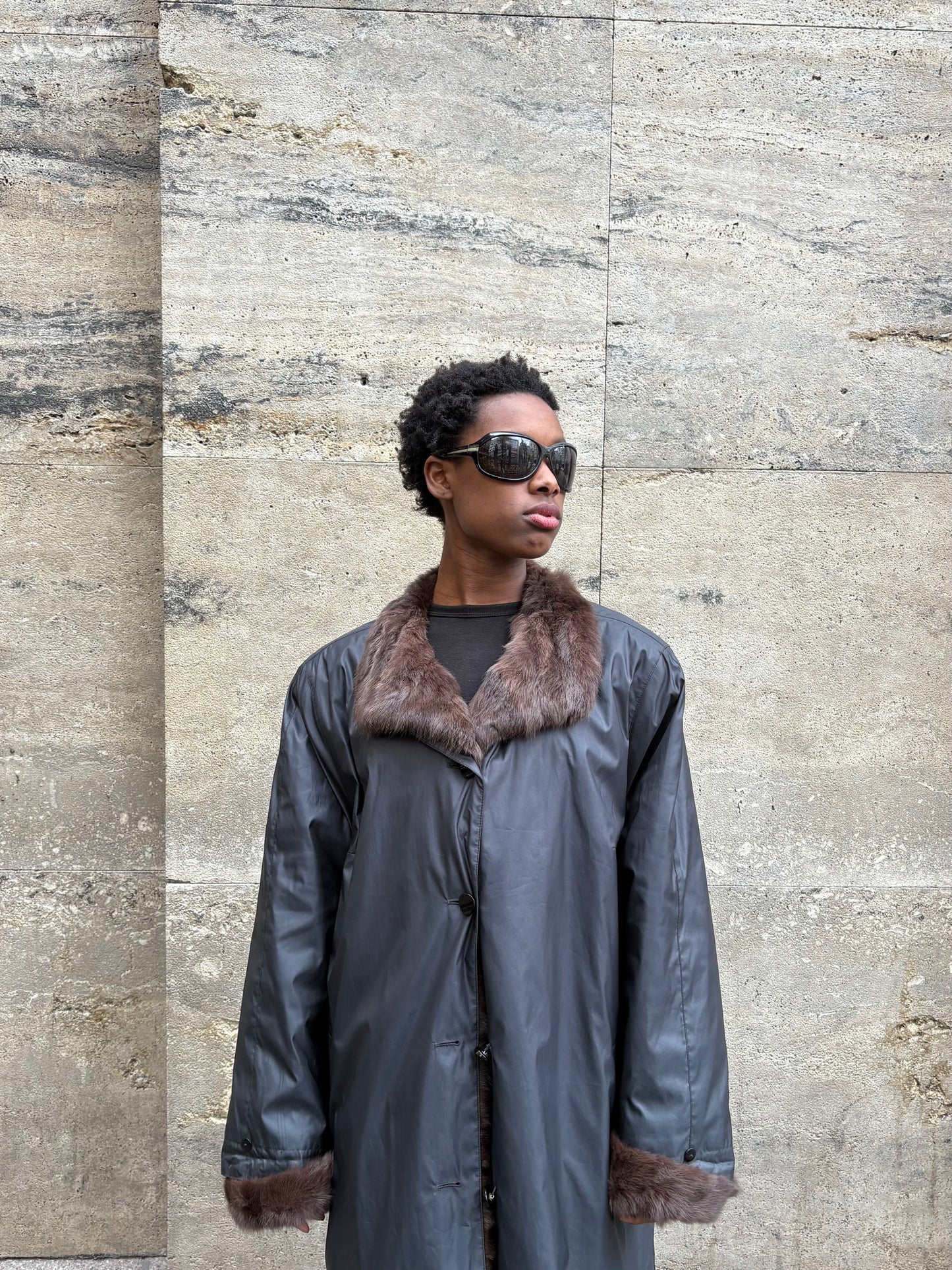 RAINCOAT WITH FUR DETAILING